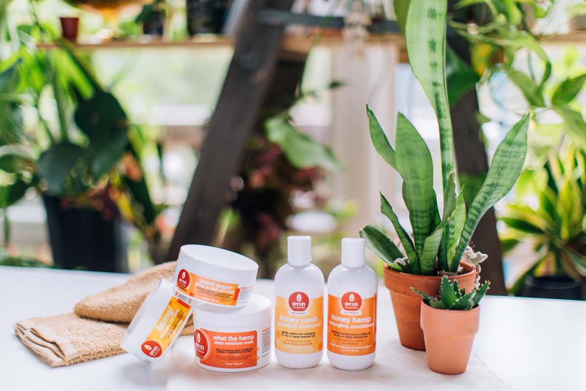 oyin handmade rich moisture products on table with plants